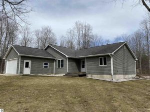 For sale. Ranch home on 5 acres along Northwoods Drive, southeast of Beulah. 