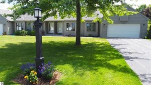 Condo for sale in Benzie County. Crystal Ridge condominium unit end for privacy. For sale by Stapleton Realty. 231-326-4000.