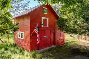 Image for Waterfront Centennial Farm is of the two-story boathouse.